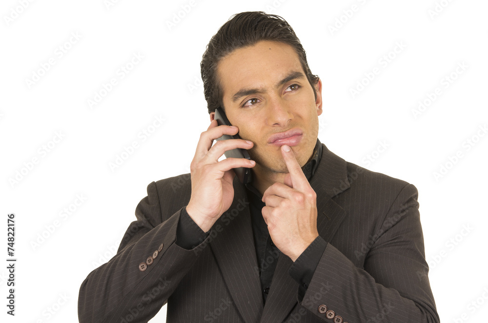 handsome young man wearing a suit posing using cell phone mobile handsome young man wearing a suit posing using cell phone mobile
