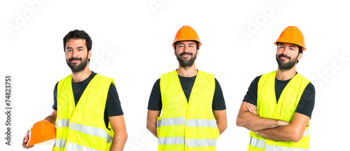 Workman with his arms crossed over white background