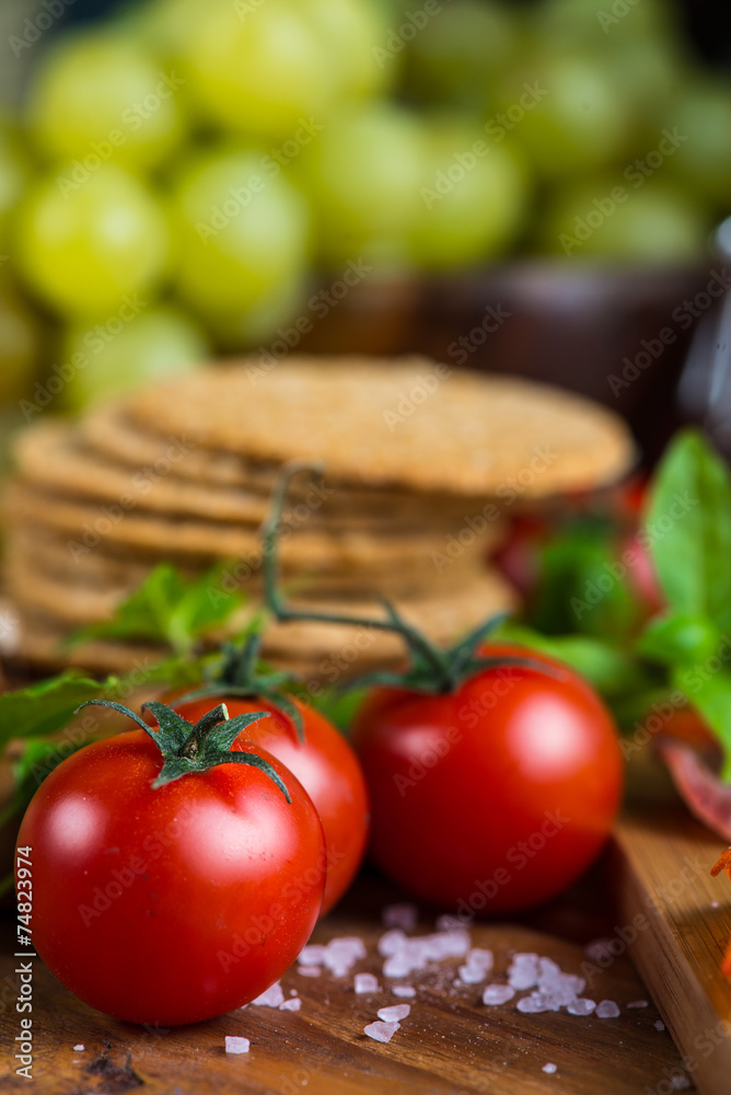 fresh organic tomatoes with basil and rock salt