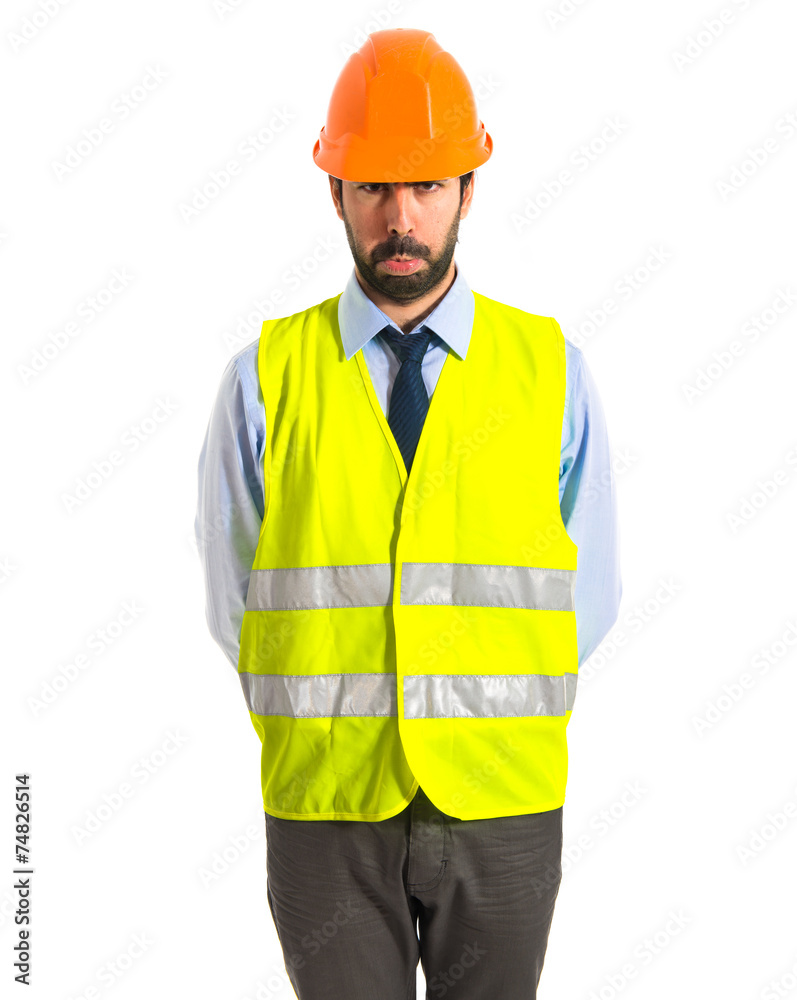 Sad worker over white background