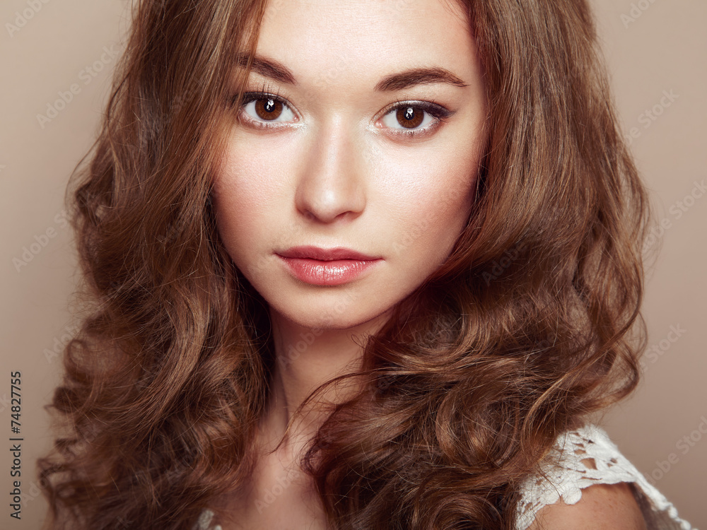 Portrait of young beautiful girl with curly hair Portrait of young beautiful girl with curly hair