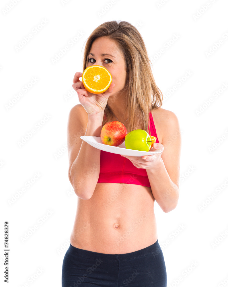 Sport woman holding fruits Sport woman holding fruits