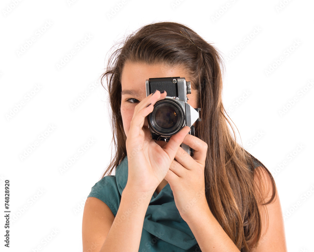Girl photographing over white background Girl photographing over white background