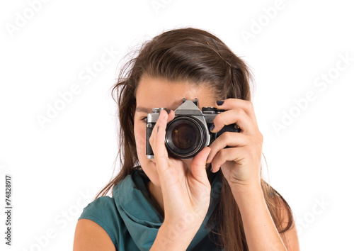 Girl photographing over white background