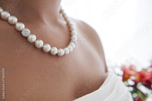 bride wearing pearls necklace
