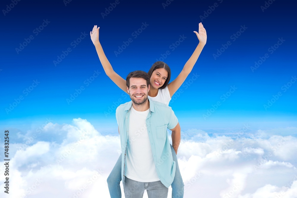 Happy casual man giving pretty girlfriend piggy back Happy casual man giving pretty girlfriend piggy back