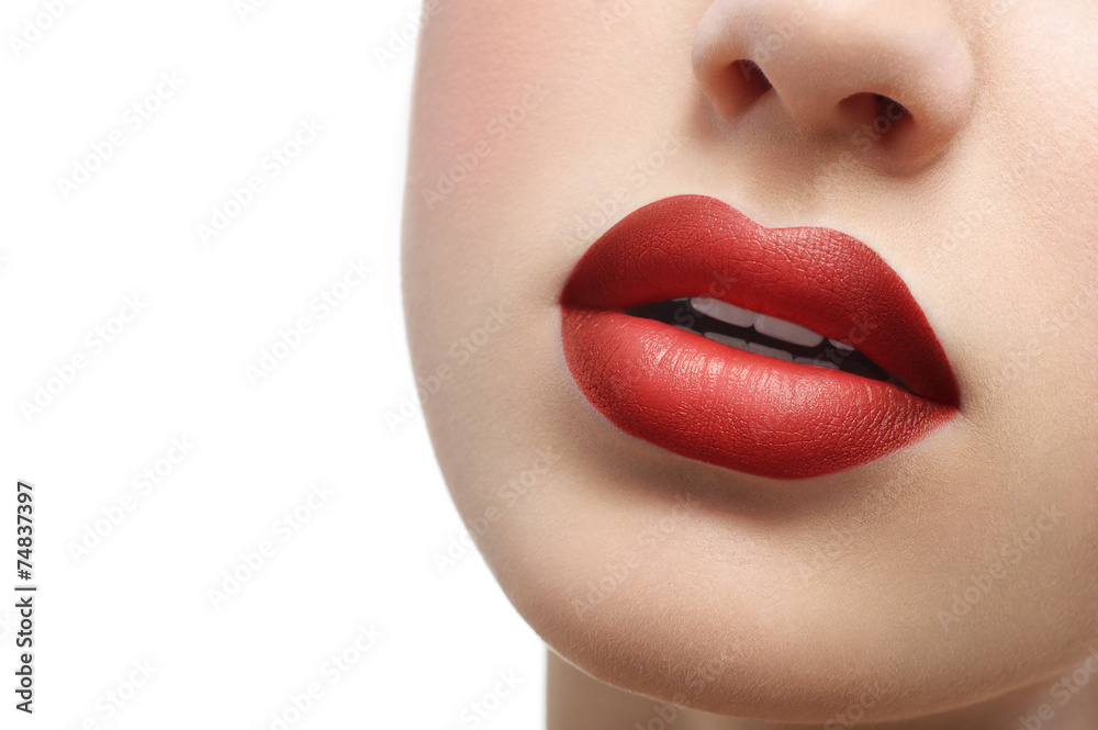 Obraz premium red lips close up on a white background