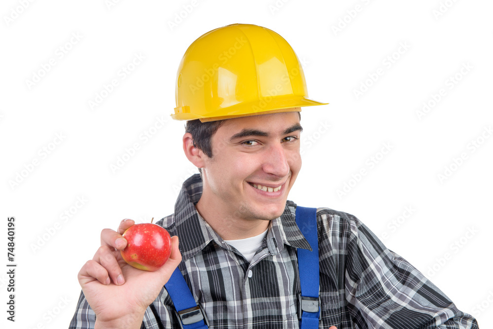 a worker with an apple smiles at the camera