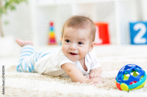 baby boy playing with toy indoor