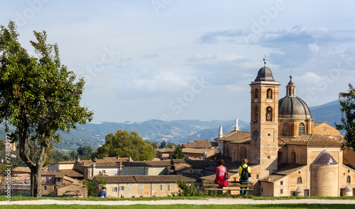 Photos couple admires panorama of Urbino, Italy