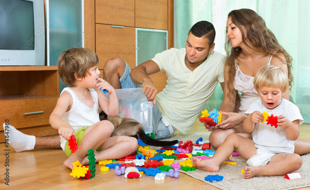 Obraz premium Happy family playing in home interior