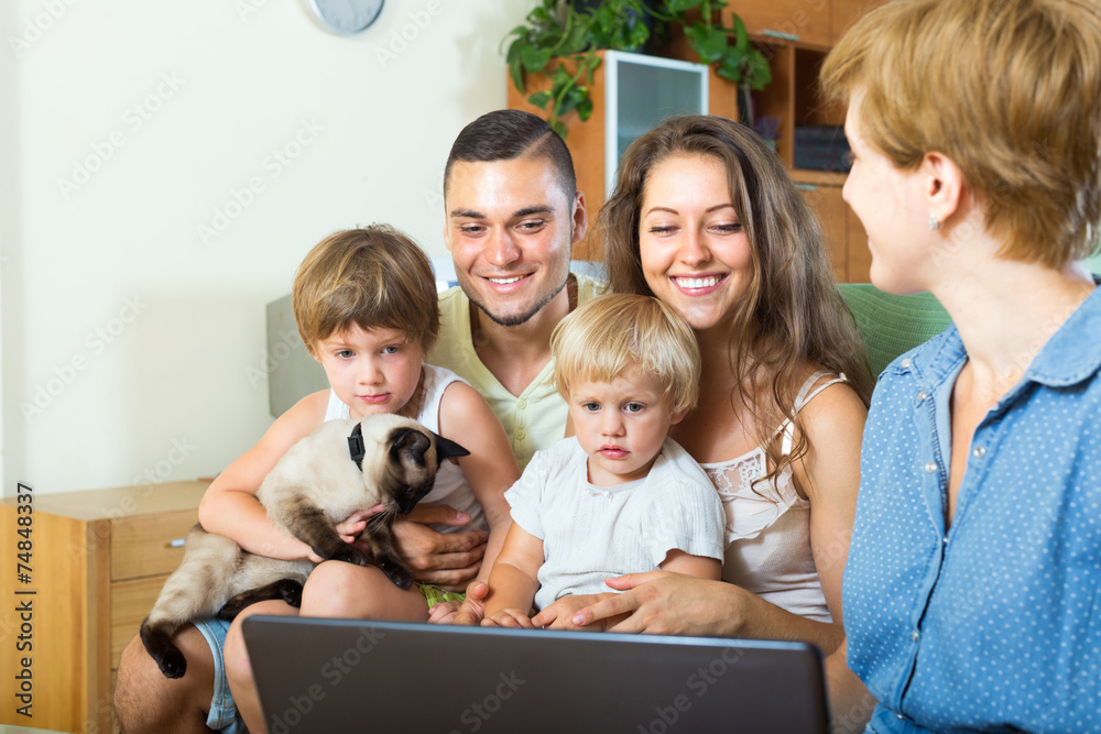  family of four listening to the insurance agent
