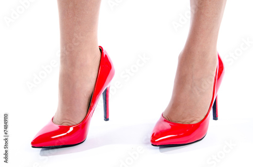 Woman wearing red high heel shoes