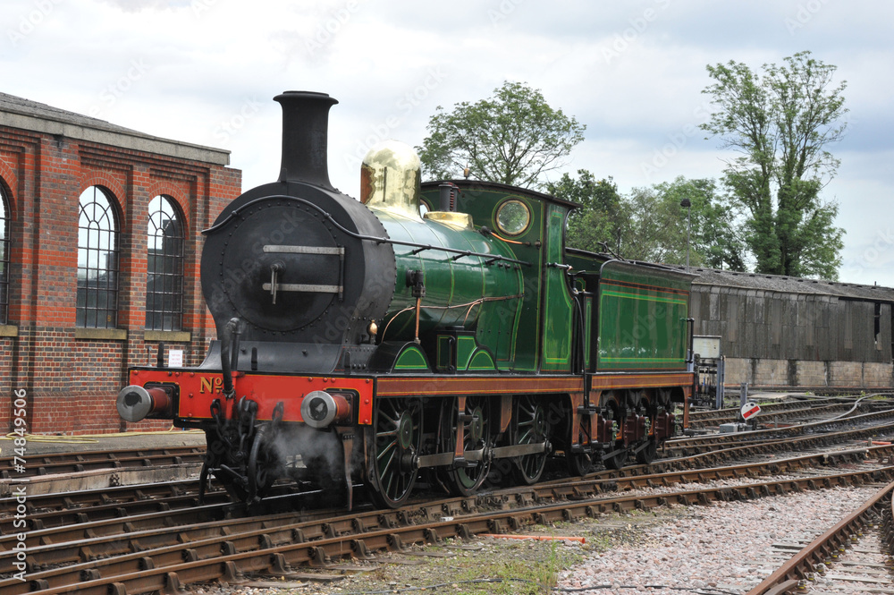 20 th century steam engine at a station in Sussex.