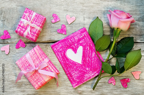 Fototapeta Naklejka Na Ścianę i Meble -  Valentine's background with gifts, flower and card