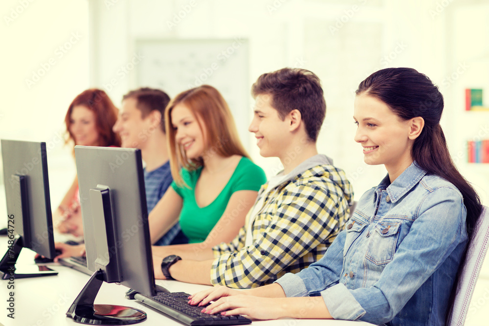 female student with classmates in computer class female student with classmates in computer class