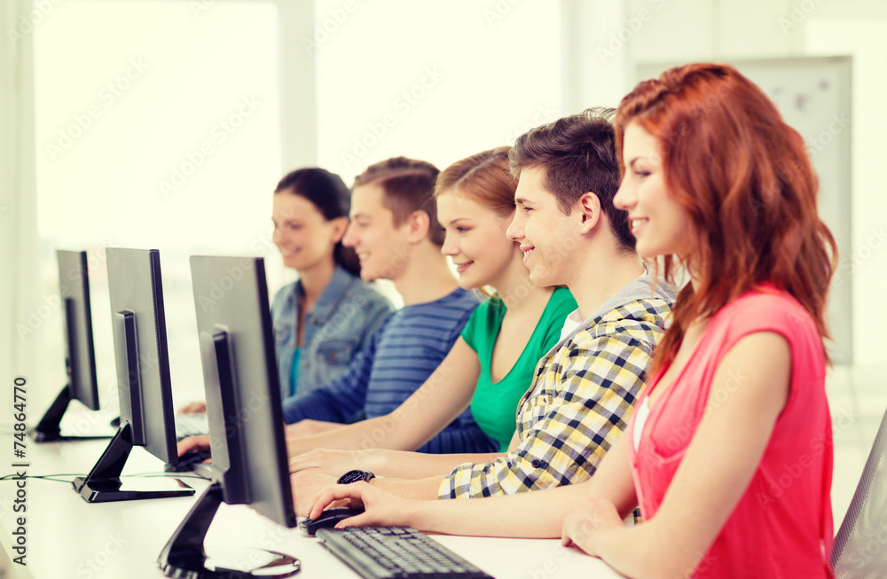 female student with classmates in computer class female student with classmates in computer class
