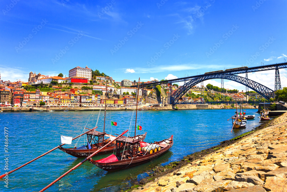 Oporto or Porto skyline, Douro river, boats and iron bridge. Por
