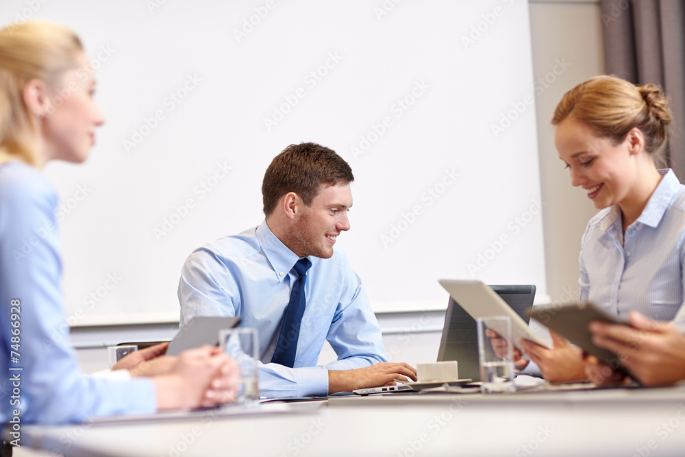 smiling business people with tablet pc in office smiling business people with tablet pc in office