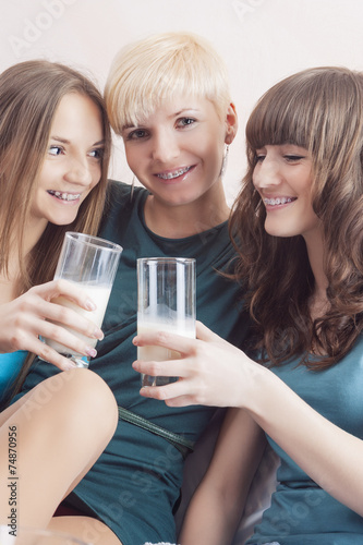 Portrait of Three Young Caucasian Ladies Wearing Dental Bracket