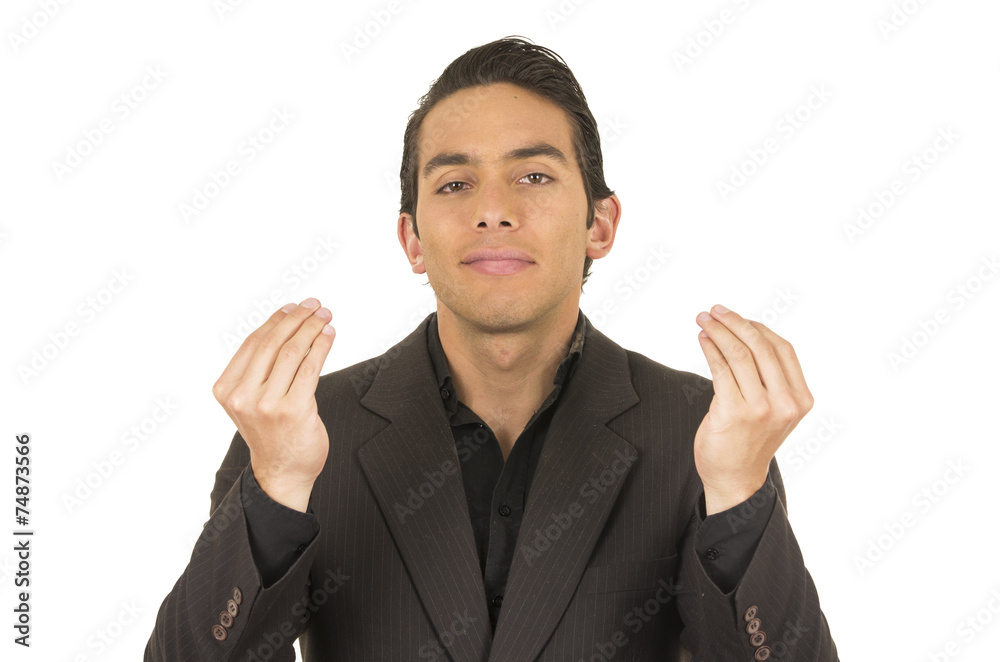 handsome young man wearing a suit posing with hands giving handsome young man wearing a suit posing with hands giving