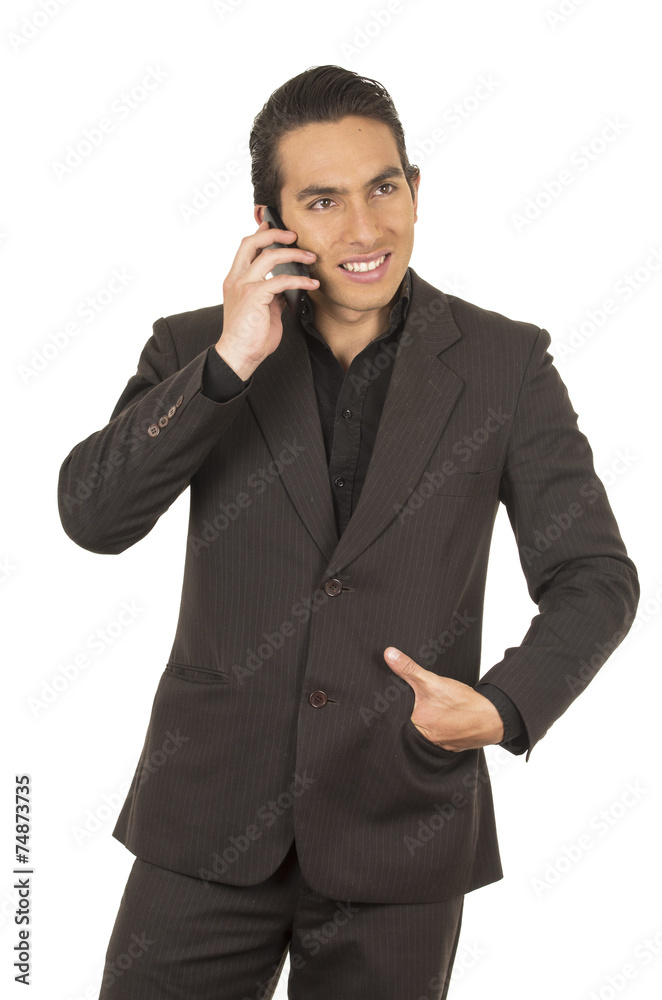 handsome young man wearing a suit posing using cell phone mobile handsome young man wearing a suit posing using cell phone mobile