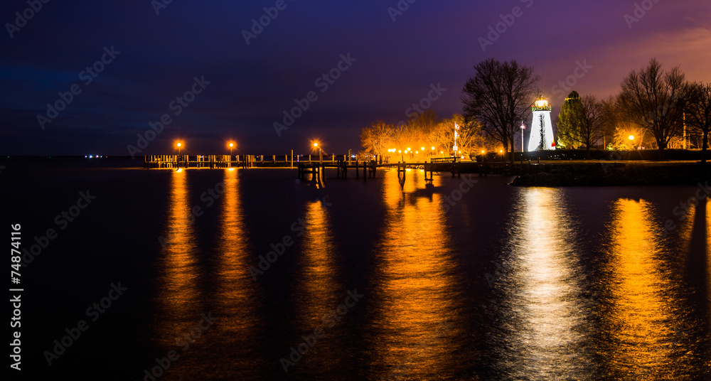 Concord Point Lighthouse and a pier at night in Havre de Grace,