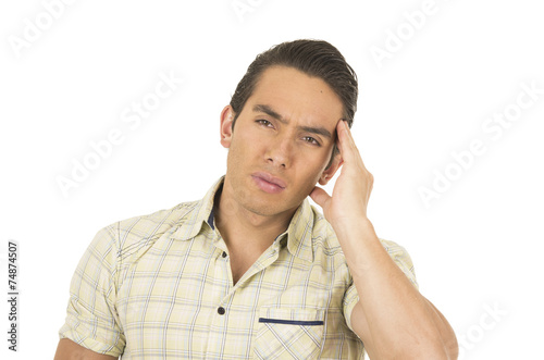 young handsome hispanic man posing with headache
