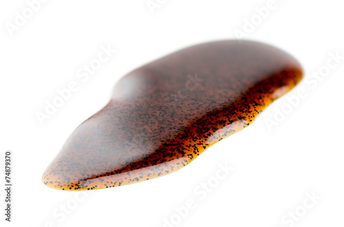 Macro closeup of natural real vanilla extract isolated on white