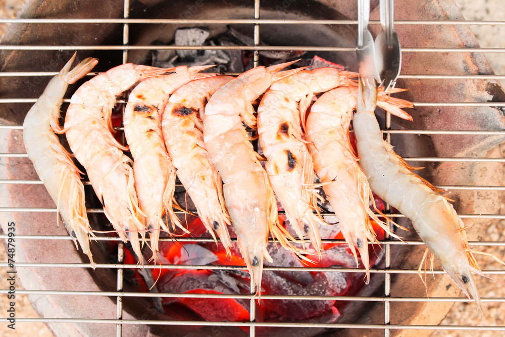 grilled fresh prawns on flaming seafood