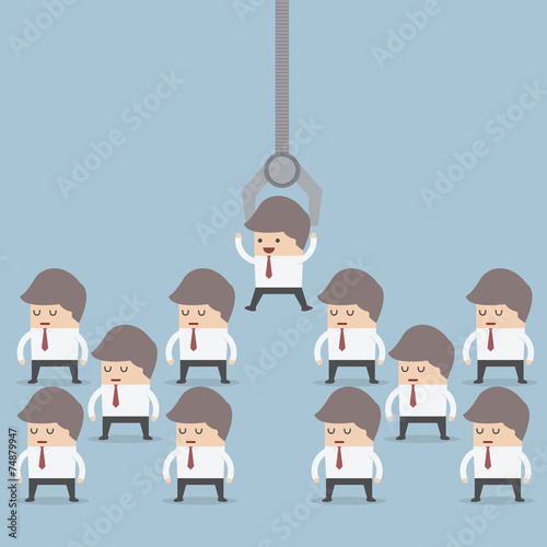 Human resource concept, Robotic claw pick businessman from a gro