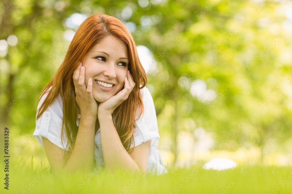 Portrait of a pretty redhead happy and lying Portrait of a pretty redhead happy and lying