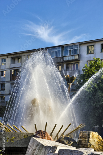Pitesti city center fountain against blue sky