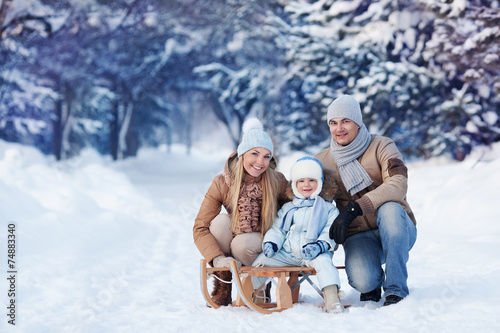 Portrait of Young family in a winter park
