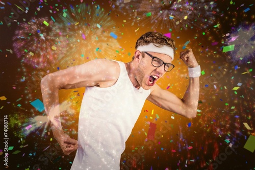 Composite image of geeky hipster posing in sportswear photo