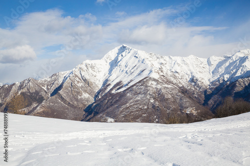 snowy mountains with clouds