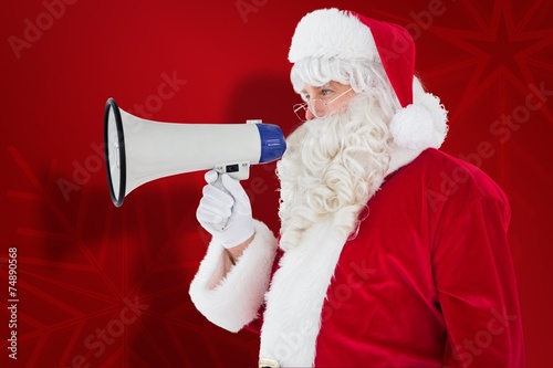 Composite image of santa claus speaking on megaphone