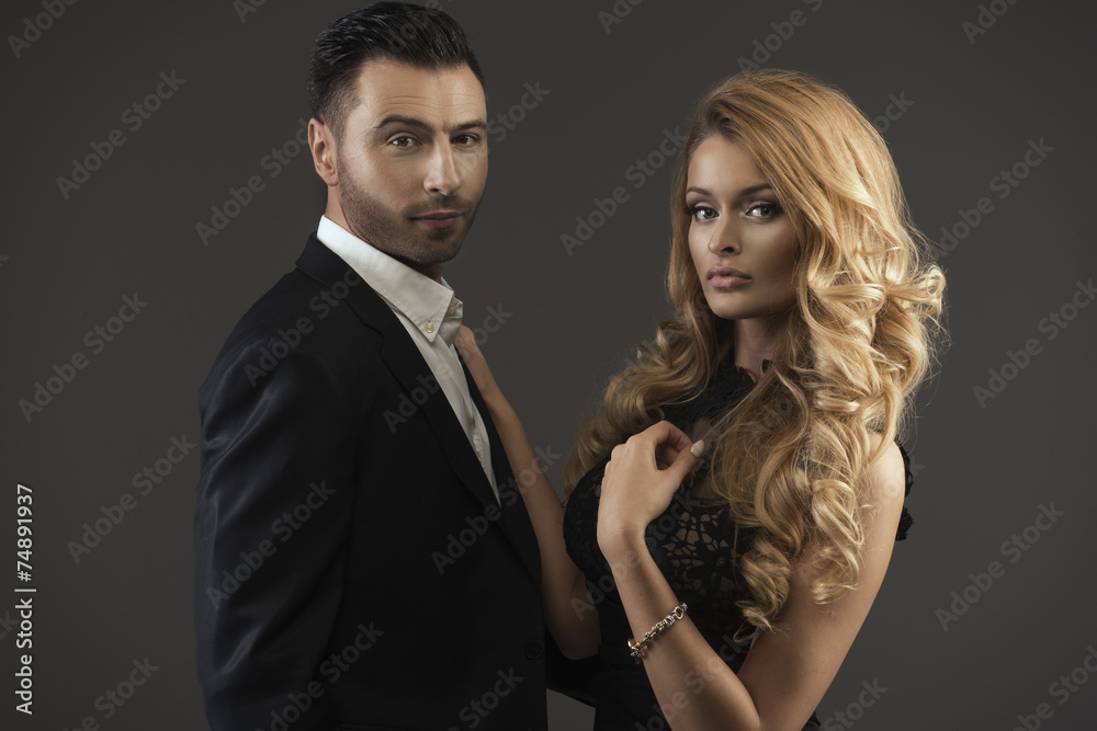 portrait of a young fashion couple looking into the camera portrait of a young fashion couple looking into the camera