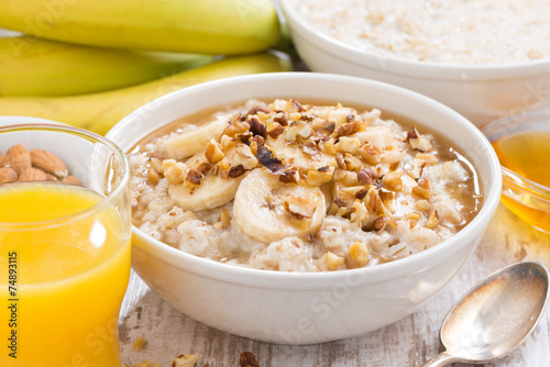 healthy breakfast - oatmeal with banana, honey and walnuts