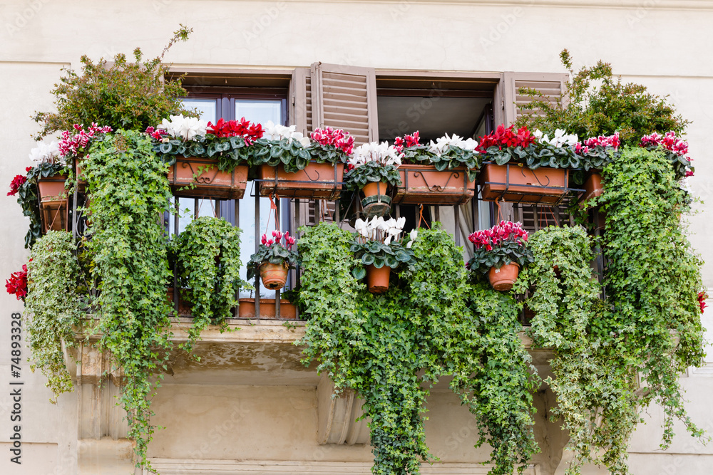 traditional balcony with flowers, old style, Italy