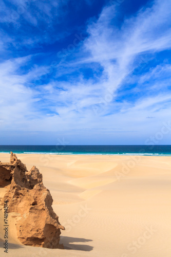 Sand dunes near to the ocean with cloudy blue sky, Boavista, Cap © Black-photography