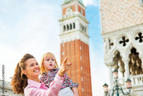 Portrait of mother and baby against campanile di san marco