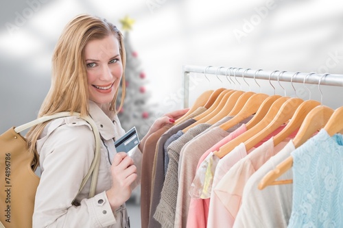 Composite image of blonde shopping