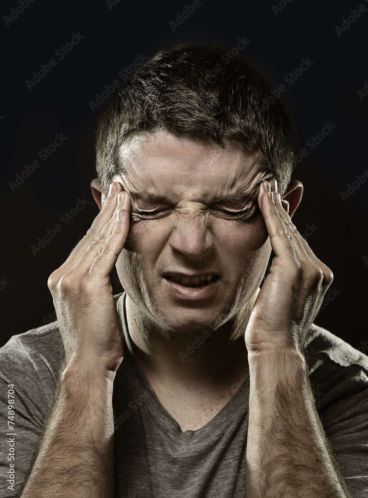 man suffering migraine headache and desperate pain in stress man suffering migraine headache and desperate pain in stress