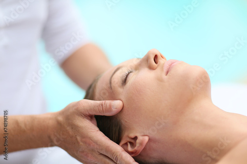 Closeup of woman receiving face massage
