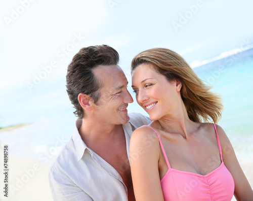 Portrait of loving middle-aged couple at the beach
