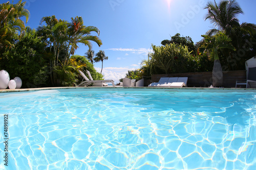 Closeup of private swimming-pool on sunny day