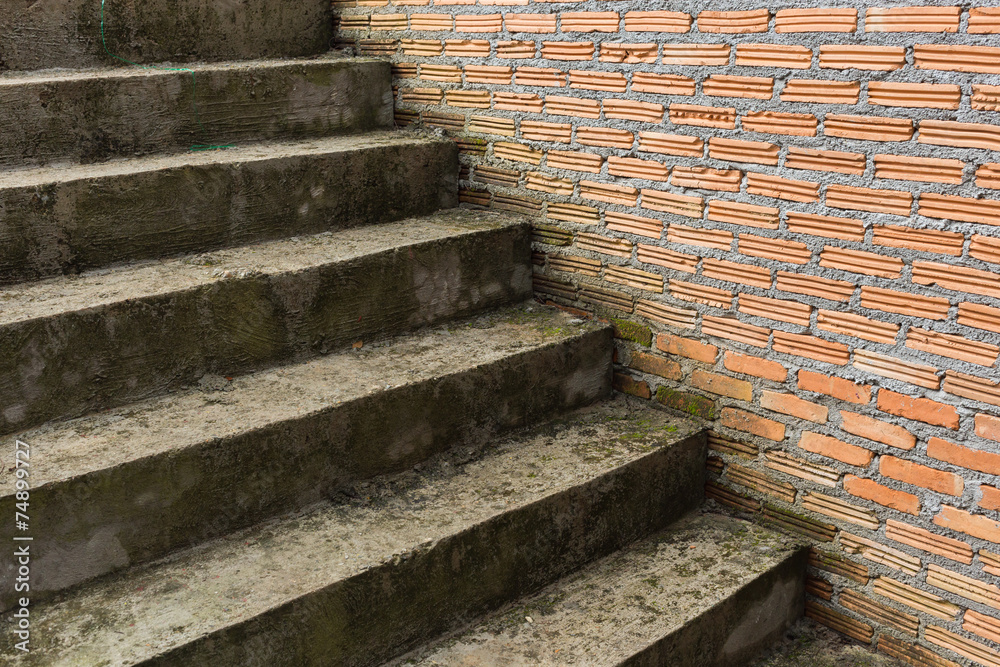cement staircase in construction site with brick wall cement staircase in construction site with brick wall