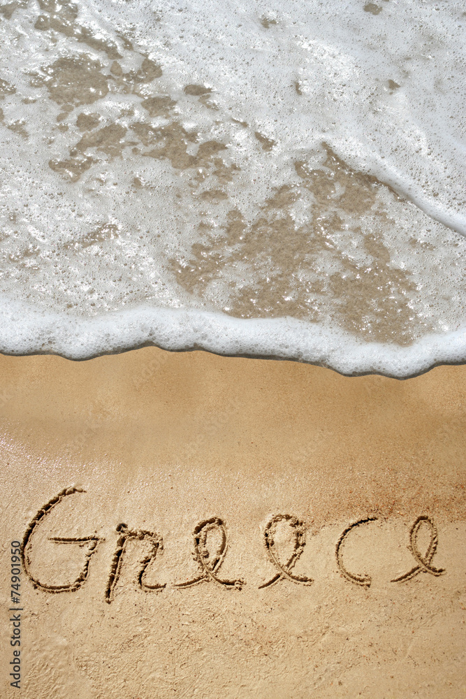 Conceptual Greece text in sand and water Conceptual Greece text in sand and water
