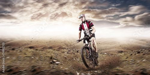 Fototapeta Naklejka Na Ścianę i Meble -  Mountain Bike cyclist riding single track